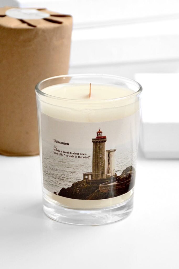 Stylish handmade soy candle with a lighthouse design, perfect for home decor and gifting.