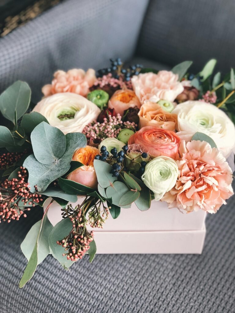 A beautiful blend of roses and eucalyptus in a stylish box, perfect for weddings and celebrations.